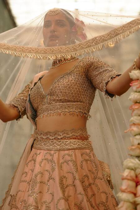 Shop_Nitika Gujral_Peach Silk, Net Embroidery, Sequins, Beads V-neck Raw Bridal Lehenga Set _Online_at_Aza_Fashions