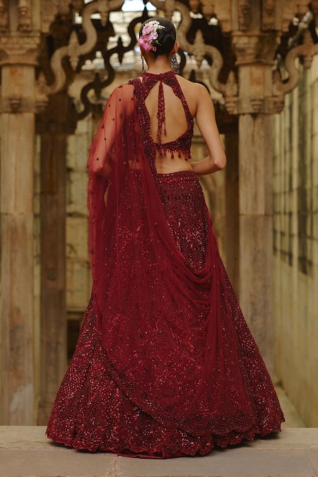 Buy_Nitika Gujral_Burgundy Net Beads, Sequins, Cut Work, Embroidery Halter Embellished Lehenga Set _Online_at_Aza_Fashions