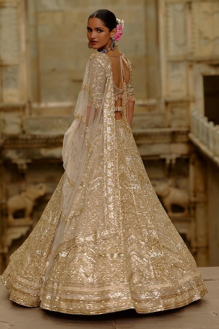 Buy_Nitika Gujral_Gold Net Crystals, Sequins, Embroidery, Zari Embellished Bridal Lehenga Set _Online_at_Aza_Fashions