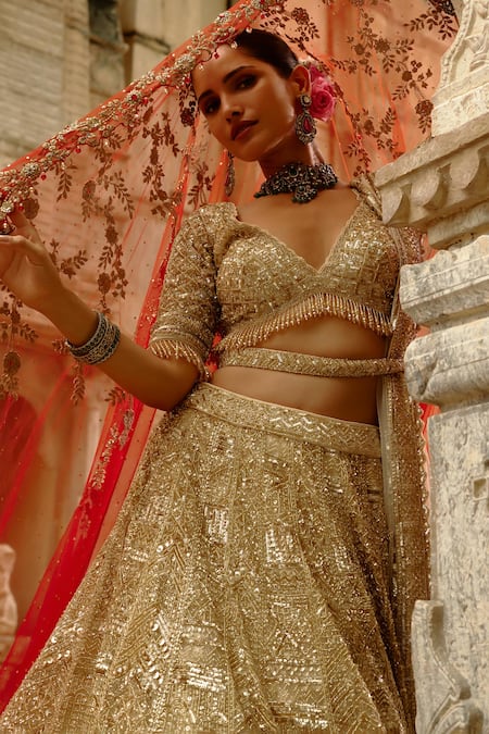Nitika Gujral_Gold Net Crystals, Sequins, Embroidery, Zari Embellished Bridal Lehenga Set _at_Aza_Fashions