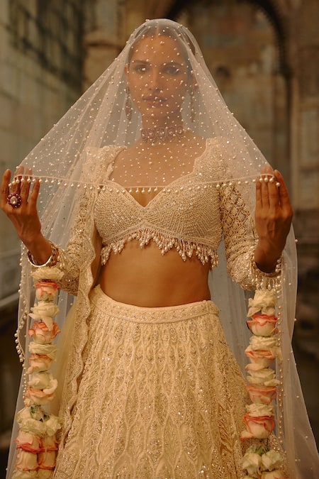 Shop Nitika Gujral Ivory Net Embroidery, Sequins, Crystals, Pearls, Embellished Bridal Lehenga Set Online at Aza Fashions Shop_Nitika Gujral_Ivory Net Embroidery, Sequins, Crystals, Pearls, Embellished Bridal Lehenga Set _Online_at_Aza_Fashions