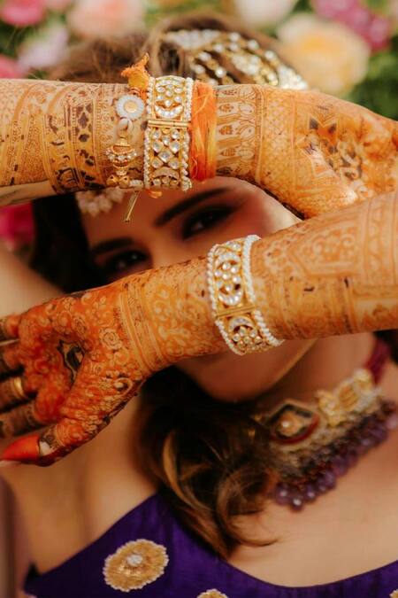 MAISARA JEWELRY Gold Plated Imitation Diamonds Kundan Studded Bangles - Set Of 2 Online at Aza Fashions MAISARA JEWELRY_Gold Plated Imitation Diamonds Kundan Studded Bangles - Set Of 2 _Online_at_Aza_Fashions