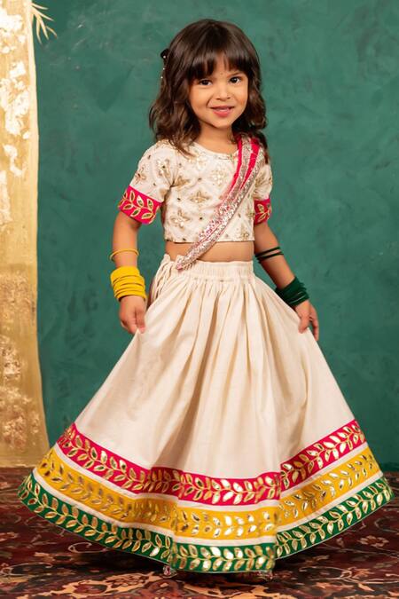 JILMIL DREAMWEAR Off White Georgette Gota Patti, Mirrors, Embroidery, Zari Lehenga Set at Aza Fashions JILMIL DREAMWEAR_Off White Georgette Gota Patti, Mirrors, Embroidery, Zari Lehenga Set _at_Aza_Fashions