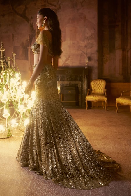 Seema Gujral_Gold Net Sequins, Beads, Crystals Off-shoulder Antqiue Trail Skirt Set _Online_at_Aza_Fashions