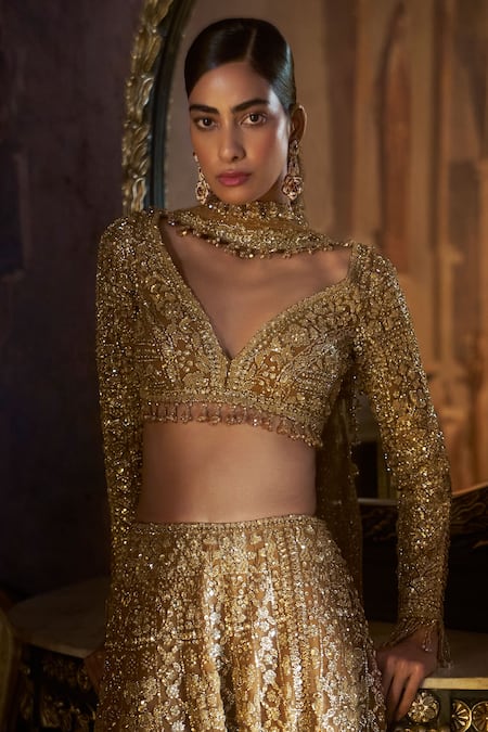 Seema Gujral_Gold Net Crystals, Beads, Sequins, Embroidery, Tassels Tonal Slit Skirt Set _at_Aza_Fashions