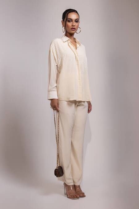 Yoseba Ivory Crepe Beads, Tassels Collared Kaddana Shirt And Pant Set Online at Aza Fashions Yoseba_Ivory Crepe Beads, Tassels Collared Kaddana Shirt And Pant Set _Online_at_Aza_Fashions