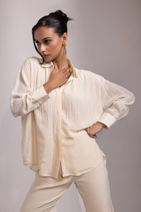 Yoseba Ivory Crepe Beads, Tassels Collared Kaddana Shirt And Pant Set at Aza Fashions Yoseba_Ivory Crepe Beads, Tassels Collared Kaddana Shirt And Pant Set _at_Aza_Fashions
