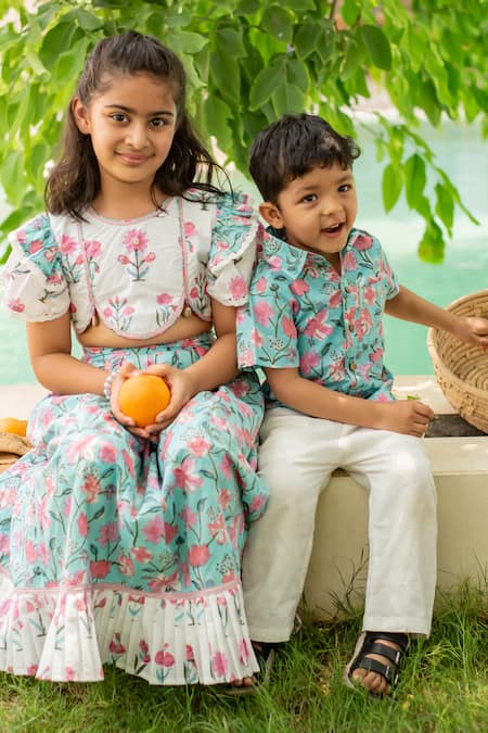 Plumcheeks_White Cotton Tassels, Ruffles Printed Blouse And Skirt Set _at_Aza_Fashions