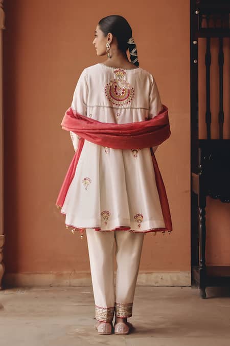 Shop Ajiesh Oberoi Ivory Silk, Tissue Mirrors, Embroidery, Gota Shehnai Flared Kurta Pant Set at Aza Fashions Shop_Ajiesh Oberoi_Ivory Silk, Tissue Mirrors, Embroidery, Gota Shehnai Flared Kurta Pant Set _at_Aza_Fashions