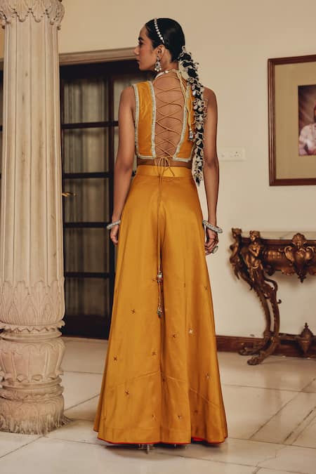 Shop Ajiesh Oberoi Mustard Silk Zari, Mirrors, Embroidery Shira Sleeveless Blouse With Sharara at Aza Fashions Shop_Ajiesh Oberoi_Mustard Silk Zari, Mirrors, Embroidery Shira Sleeveless Blouse With Sharara _at_Aza_Fashions