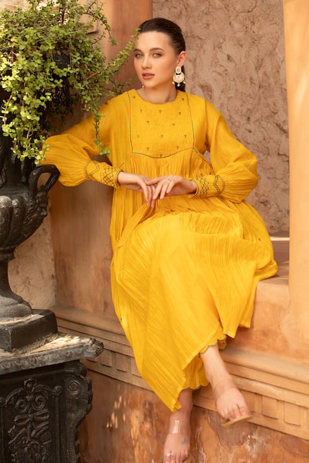 Amoree by Shikha Chaudhry_Mustard Cotton Embroidery Round Neck Marigold Charm Kurta With Pant _at_Aza_Fashions