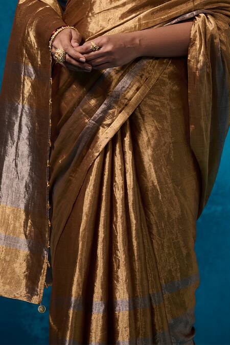 Dressfolk Gold Tissue Isha Pre-draped Saree With Unstitched Blouse Piece at Aza Fashions Dressfolk_Gold Tissue Isha Pre-draped Saree With Unstitched Blouse Piece_at_Aza_Fashions