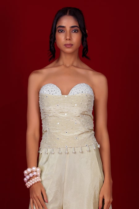 Buy Label Niyami Ivory Tissue Pearls, Sequins Sweetheart Neck Embroidered Corset And Sharara Set Online at Aza Fashions Buy_Label Niyami_Ivory Tissue Pearls, Sequins Sweetheart Neck Embroidered Corset And Sharara Set _Online_at_Aza_Fashions
