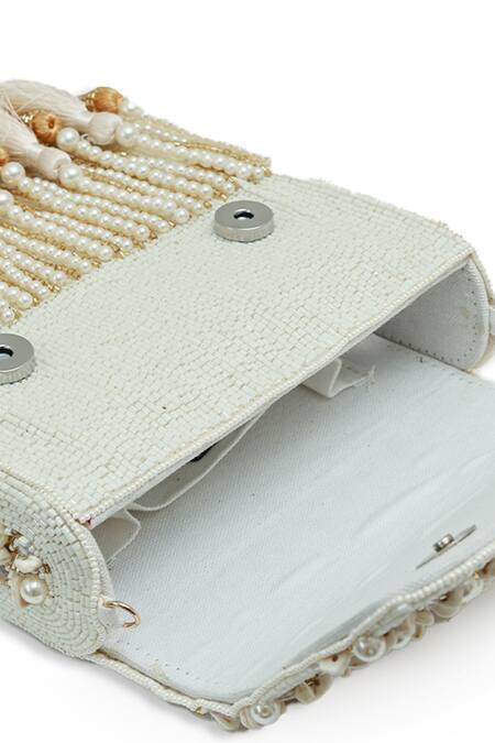 The Tan Clan White Beads, Pearls, Tassels Jena Embellished Flapover Bag Online at Aza Fashions The Tan Clan_White Beads, Pearls, Tassels Jena Embellished Flapover Bag _Online_at_Aza_Fashions