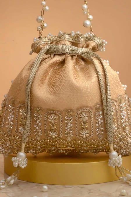 Amyra Peach Cut Work, Pearls, Tassels, Lace Geet Brocade Embellished Potli - at Aza Fashions Amyra_Peach Cut Work, Pearls, Tassels, Lace Geet Brocade Embellished Potli -_at_Aza_Fashions