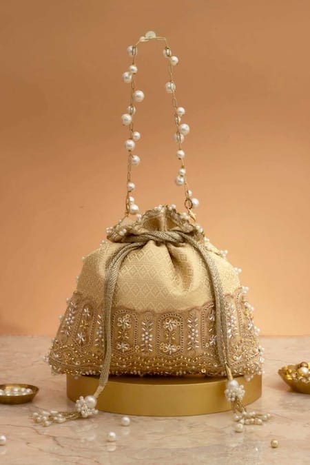 Amyra Cream Cut Work, Pearls, Tassels, Embroidery Geet Brocade Embellished Potli - 