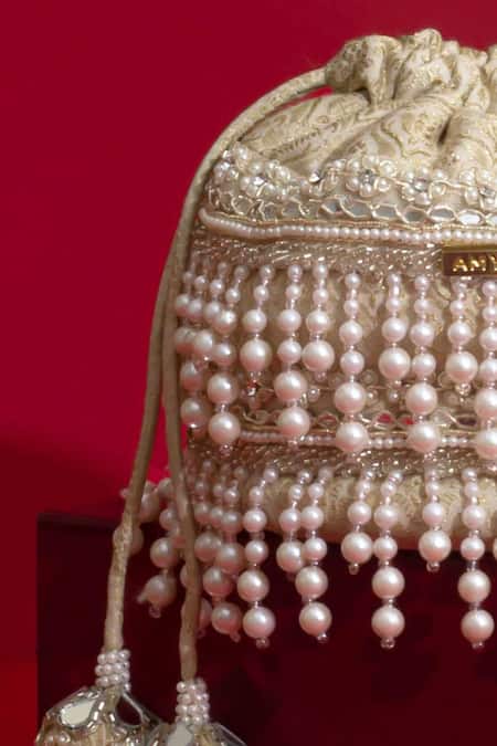 Shop Amyra Ivory Pearls, Cut Work, Sequins, Embroidery, Tassels Anahi Brocade Mini Potli - Online at Aza Fashions Shop_Amyra_Ivory Pearls, Cut Work, Sequins, Embroidery, Tassels Anahi Brocade Mini Potli - _Online_at_Aza_Fashions