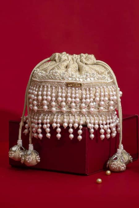 Amyra Ivory Pearls, Cut Work, Sequins, Embroidery, Tassels Anahi Brocade Mini Potli - Online at Aza Fashions Amyra_Ivory Pearls, Cut Work, Sequins, Embroidery, Tassels Anahi Brocade Mini Potli - _Online_at_Aza_Fashions