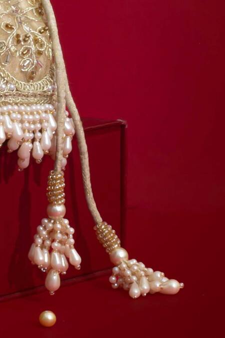 Shop_Amyra_Beige Pearls, Embroidery, Tassels, Beads Sehra Mini Potli - _Online_at_Aza_Fashions