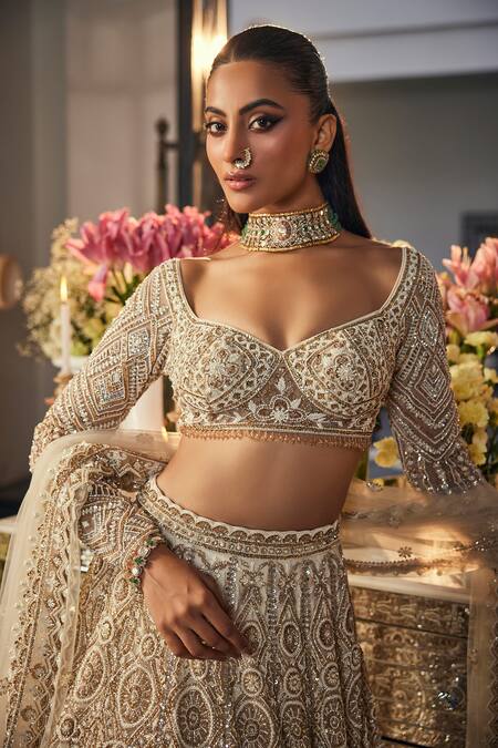 Isa By Dolly Wahal_Ivory Net Sequins, Crystals, Pearls, Embroidery, Ombre Gold Bridal Lehenga Set _at_Aza_Fashions