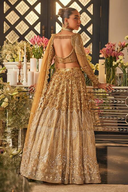 Isa By Dolly Wahal_Gold Net Sequins, Crystals, Beads, Embroidery Embellished Bridal Lehenga Set _at_Aza_Fashions