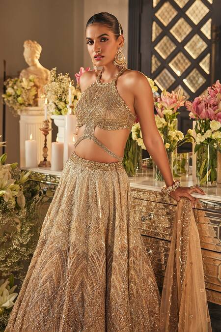 Buy_Isa By Dolly Wahal_Gold Net Sequins, Crystals, Embroidery Halter Neck Zara Embellished Lehenga Set _Online_at_Aza_Fashions