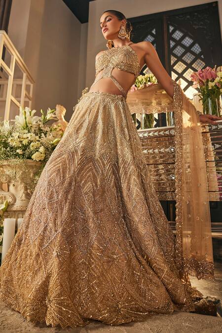 Shop_Isa By Dolly Wahal_Gold Net Sequins, Crystals, Embroidery Halter Neck Zara Embellished Lehenga Set _Online_at_Aza_Fashions