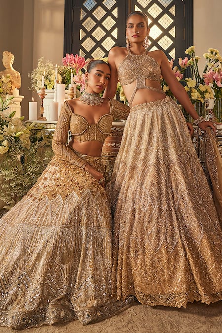 Isa By Dolly Wahal_Gold Net Sequins, Crystals, Embroidery Halter Neck Zara Embellished Lehenga Set _at_Aza_Fashions