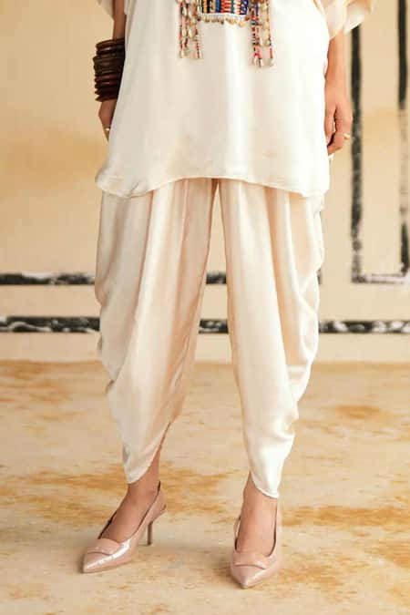 Rainas_Cream Satin Embroidery, Mirrors, Tassels Marusthal Muse Top And Dhoti Pant Set _at_Aza_Fashions