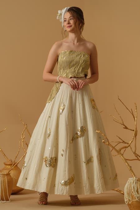 Abstract By Megha Jain Madaan Gold Georgette, Tissue Sequins Bandeau Neck Embellished Ruched Top With Skirt 