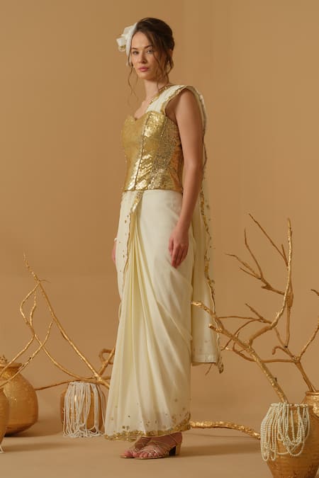Abstract By Megha Jain Madaan_Gold Silk, Crepe, Jersey, Cotton Pre-draped Saree With Embellished Corset _at_Aza_Fashions