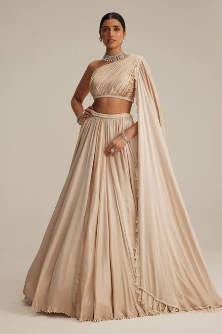 Vvani By Vani Vats Beige Satin Pearls, Tassels One Shoulder Light Lehenga Set Online at Aza Fashions Vvani By Vani Vats_Beige Satin Pearls, Tassels One Shoulder Light Lehenga Set _Online_at_Aza_Fashions