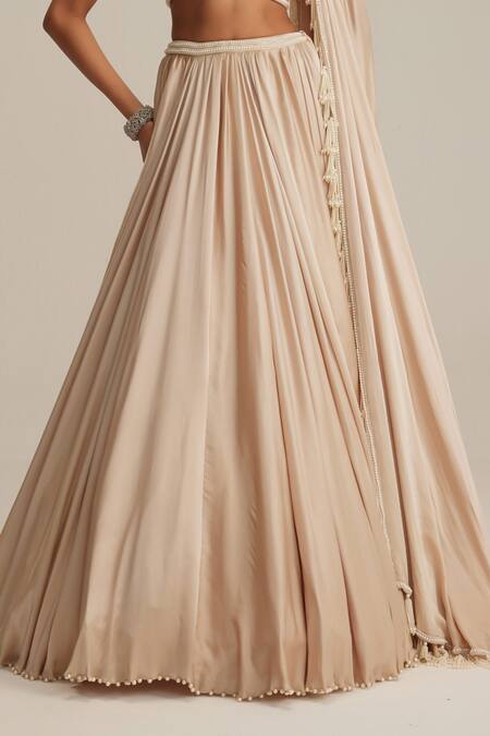 Buy Vvani By Vani Vats Beige Satin Pearls, Tassels One Shoulder Light Lehenga Set Online at Aza Fashions Buy_Vvani By Vani Vats_Beige Satin Pearls, Tassels One Shoulder Light Lehenga Set _Online_at_Aza_Fashions