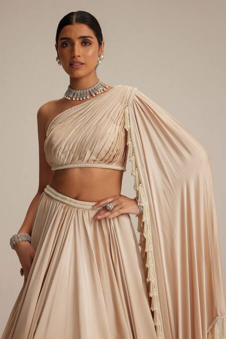Shop Vvani By Vani Vats Beige Satin Pearls, Tassels One Shoulder Light Lehenga Set Online at Aza Fashions Shop_Vvani By Vani Vats_Beige Satin Pearls, Tassels One Shoulder Light Lehenga Set _Online_at_Aza_Fashions