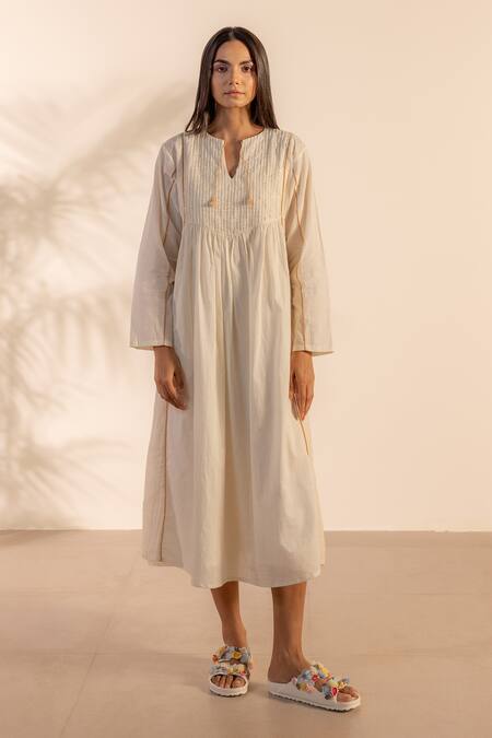 Buy Ourdve Beige Cotton Embroidery, Tassels Split V-neck Sunpetal Gathered Dress Online at Aza Fashions Buy_Ourdve_Beige Cotton Embroidery, Tassels Split V-neck Sunpetal Gathered Dress _Online_at_Aza_Fashions