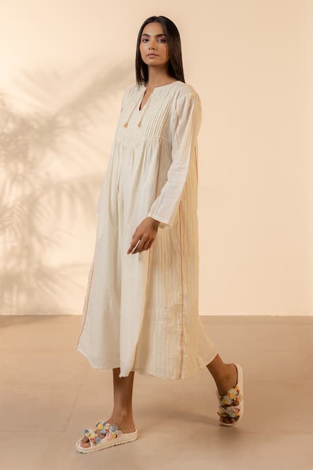 Shop Ourdve Beige Cotton Embroidery, Tassels Split V-neck Sunpetal Gathered Dress Online at Aza Fashions Shop_Ourdve_Beige Cotton Embroidery, Tassels Split V-neck Sunpetal Gathered Dress _Online_at_Aza_Fashions