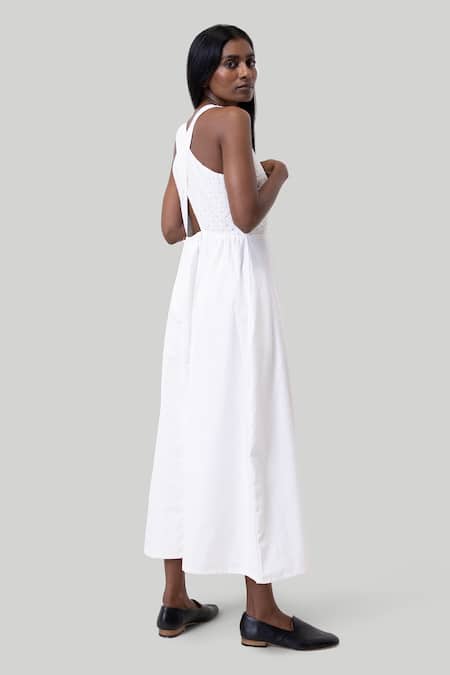 Shop Reistor White Cotton Embroidery Round Neck Coconut Cross-back Midi Dress at Aza Fashions Shop_Reistor_White Cotton Embroidery Round Neck Coconut Cross-back Midi Dress _at_Aza_Fashions