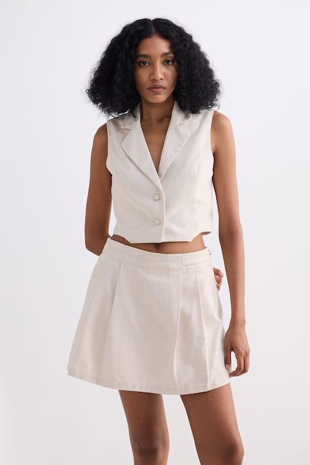 Shop_Reistor_Cream Cotton Notched Neck Tweed Cropped Vest And Pleated Skorts Set _Online_at_Aza_Fashions
