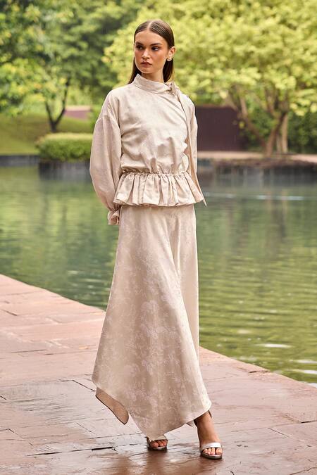 Therealb Ivory Jacquard High Neck Peplum Top And Asymmetric Skirt Set at Aza Fashions Therealb_Ivory Jacquard High Neck Peplum Top And Asymmetric Skirt Set _at_Aza_Fashions