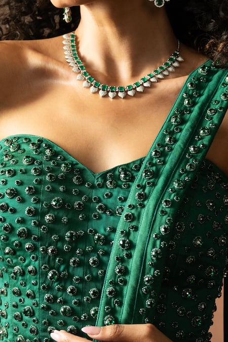 Quench A Thirst_Emerald Green Satin Stones, Pre-draped Saree And Embroidered Corset Blouse Set _at_Aza_Fashions