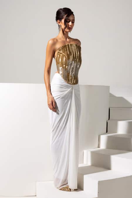 Vesture_Gold Lycra, Mesh Zari, Beads Bandeau Neck Radiance Corset And White Draped Skirt _at_Aza_Fashions
