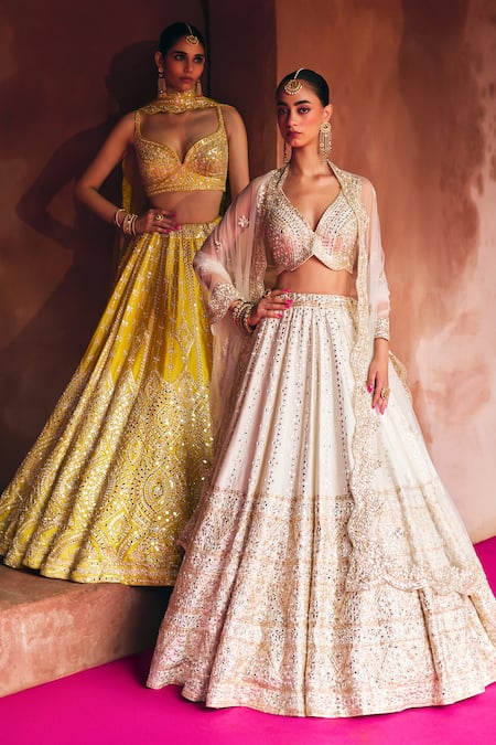 Buy Angad Singh Ivory Silk, Net Mirrors, Zari, Gota Patti, Embroidery Raw Bridal Lehenga Set Buy_Angad Singh_Ivory Silk, Net Mirrors, Zari, Gota Patti, Embroidery Raw Bridal Lehenga Set