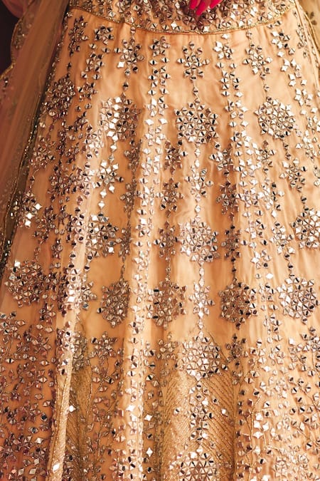 Angad Singh_Gold Organza Mirrors, Embroidery, Tassels Off-shoulder Bridal Lehenga Set _at_Aza_Fashions