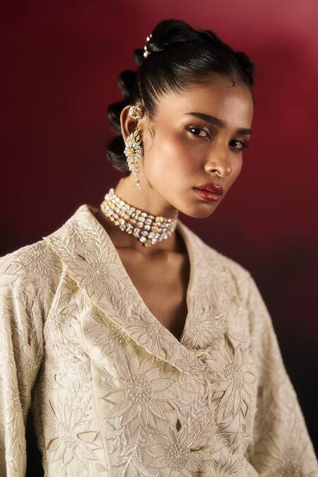 Aanchal Vijaywargi_Ivory Chanderi, Net Embroidery, Cut Work Pearl Glow Peplum Blazer With Palazzo _at_Aza_Fashions