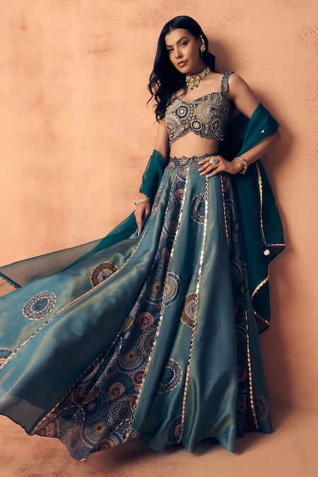 Buy_Label Moni K_Teal Tissue, Crepe, Organza Embroidery, Zari, Chakra Scallop Lehenga Set 