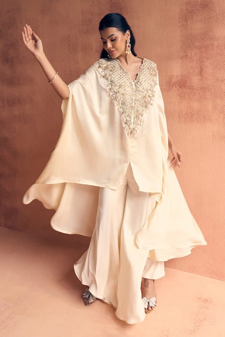 Buy Label Moni K Ivory Satin Embroidery, Beads V-neck Sway Kaftan With Pant Online at Aza Fashions Buy_Label Moni K_Ivory Satin Embroidery, Beads V-neck Sway Kaftan With Pant _Online_at_Aza_Fashions