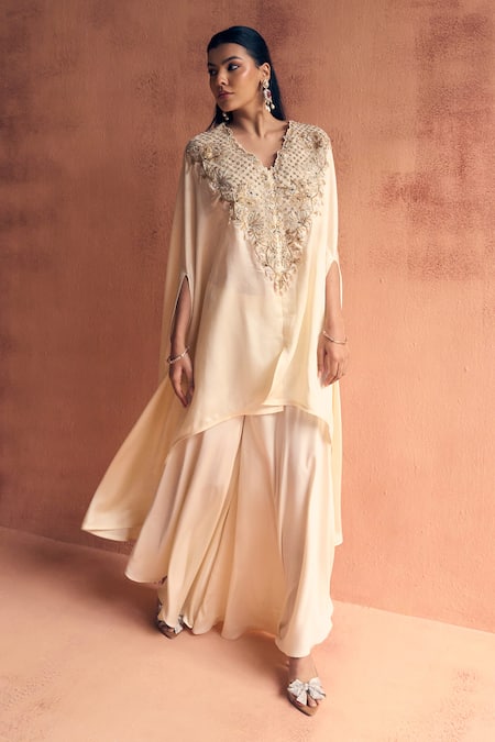 Shop Label Moni K Ivory Satin Embroidery, Beads V-neck Sway Kaftan With Pant Online at Aza Fashions Shop_Label Moni K_Ivory Satin Embroidery, Beads V-neck Sway Kaftan With Pant _Online_at_Aza_Fashions
