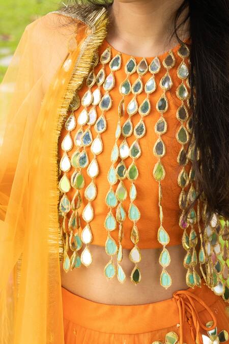 Panchhi By Kanupriya Tibrewala Orange Silk, Net Mirrors, Embroidery, Tassels, Gota Patti, Ek Phool Lehenga Set at Aza Fashions Panchhi By Kanupriya Tibrewala_Orange Silk, Net Mirrors, Embroidery, Tassels, Gota Patti, Ek Phool Lehenga Set _at_Aza_Fashions