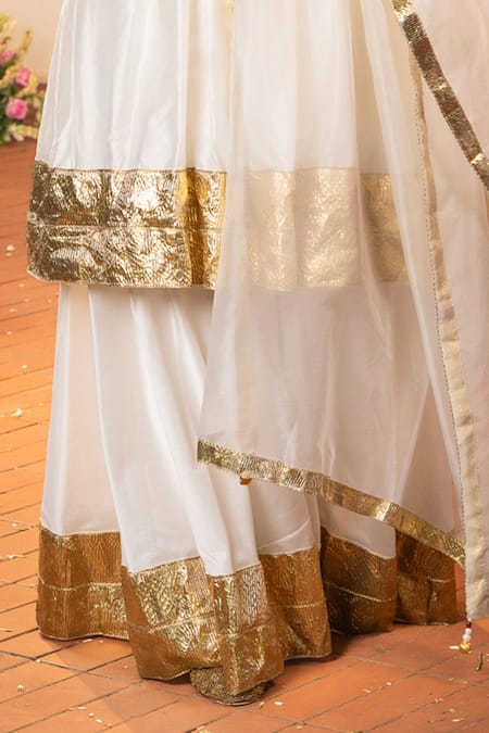 Shop Panchhi By Kanupriya Tibrewala Off White Chanderi Embroidery, Zari, Gota Patti Samriddhi Tunic Palazzo Set Online at Aza Fashions Shop_Panchhi By Kanupriya Tibrewala_Off White Chanderi Embroidery, Zari, Gota Patti Samriddhi Tunic Palazzo Set _Online_at_Aza_Fashions