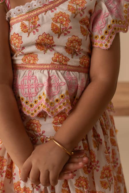 Plumcheeks White Cotton Embroidery, Tassels Pihu One Shoulder Top And Lehenga Set at Aza Fashions Plumcheeks_White Cotton Embroidery, Tassels Pihu One Shoulder Top And Lehenga Set _at_Aza_Fashions